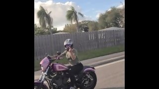 Bonnie public flashing while riding motorcycle