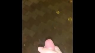 cumming in a busy street at night