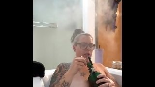 BBW step mom MILF takes 420 smoking bong hits in the jacuzzi tub