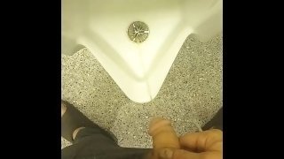 Pissing in a public bathroom