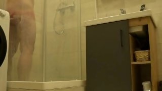 Stepmom takes a shower and cums