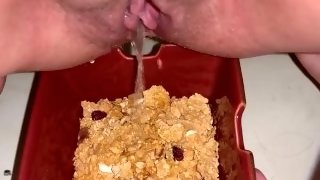 Girl pees in bowl of cereal